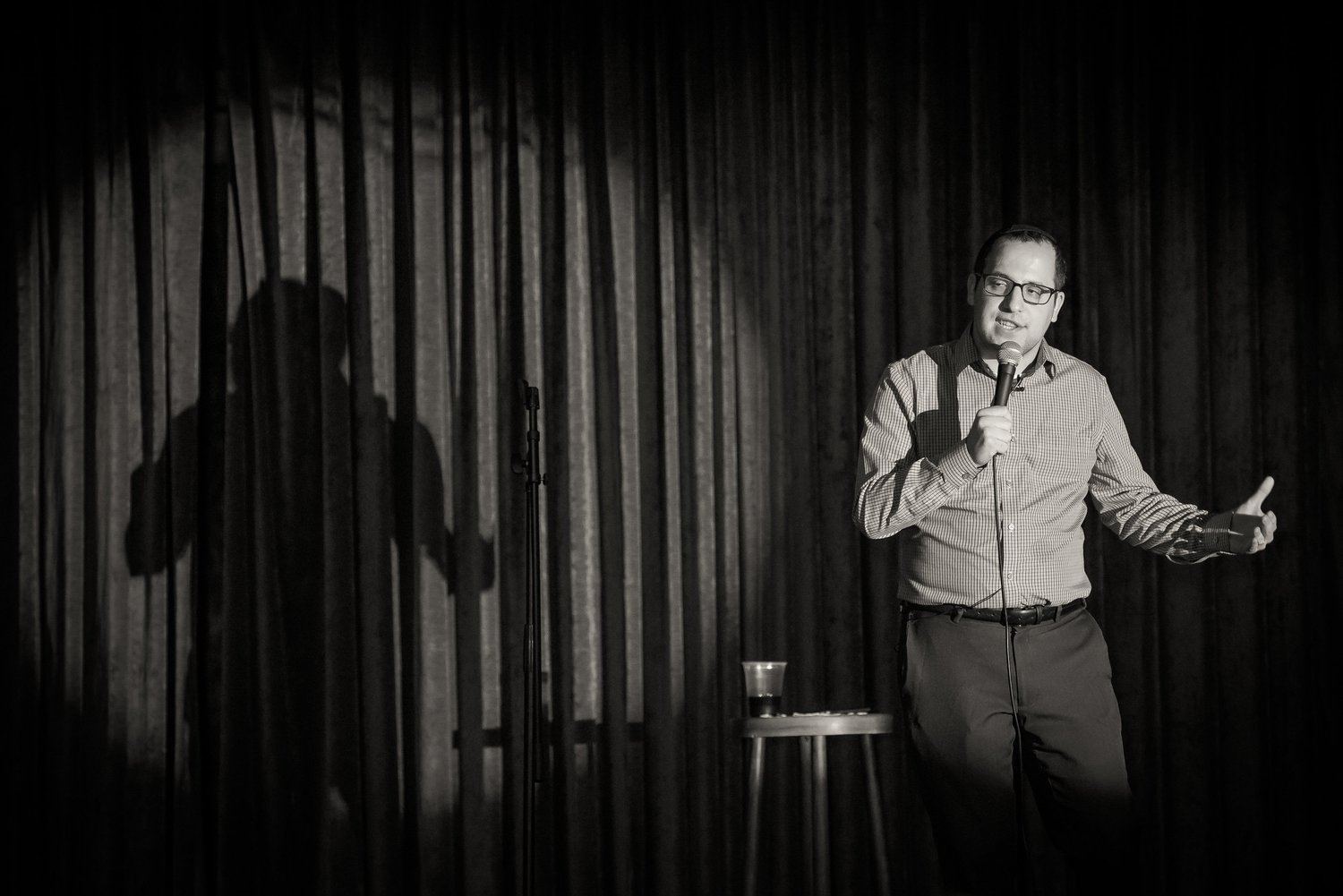 Eli Lebowicz performing standup onstage